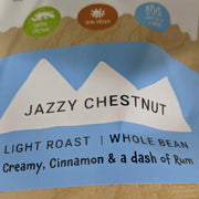 Velasquez Family Coffee Jazy Chestnut coffee flavor Creamy Cinnamon & Rum. Image coffee bag label Jazzy Chestnut, Light Roast, Whole bean, Creamy, Cinnamon & a dash of Rum