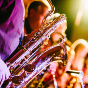 Velasquez Family Coffee Jazy Chestnut coffee flavor Creamy Cinnamon & Rum, image of jazz musicians playing saxophone