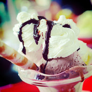 Chocolate and Vanilla Ice Cream Hot Fudge Sundae topped with whipped cream