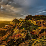 Mountain landscape with a winding road and Velasquez Family Coffee fundraiser logo overlay, Butterscotch crème and rich hazelnut flavored coffee