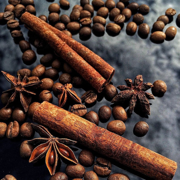Images shows cinnamon sticks and coffee beans. This flavor celebrates the fall flavors of nutmeg, cinnamon and spice